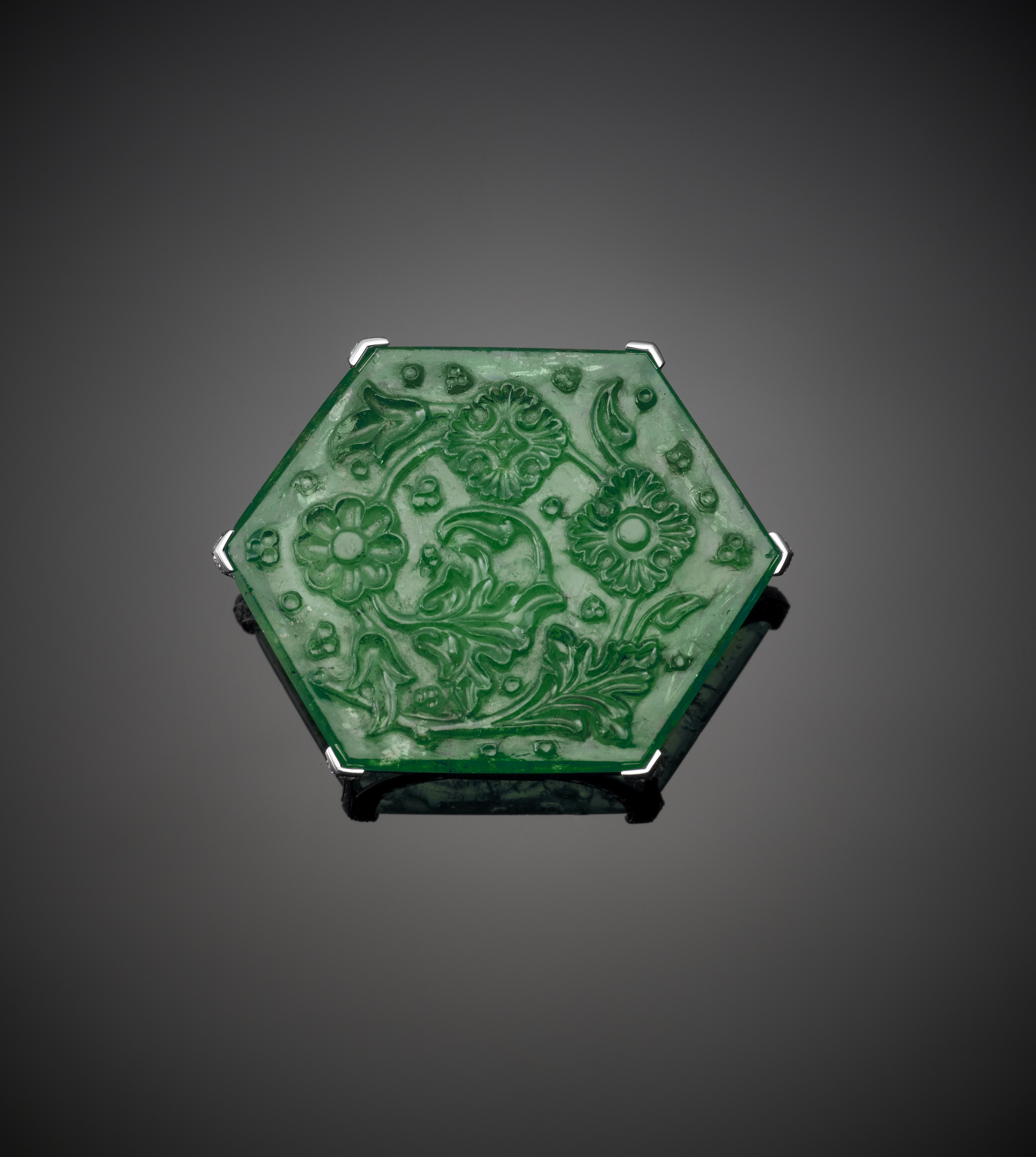 Carved Emerald in platinum mount by Cartier, 2010