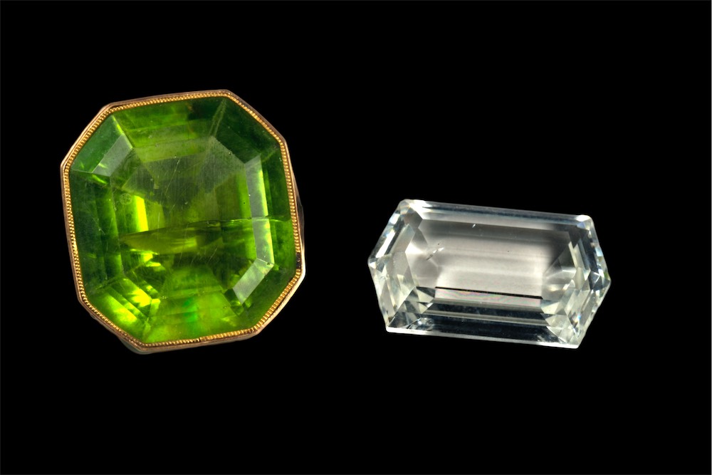 DSC_9130b facetted green peridot (20 ct) from Egypt (18th century) and colorless forsterite (10 ct) from Tajikistan (21st century)