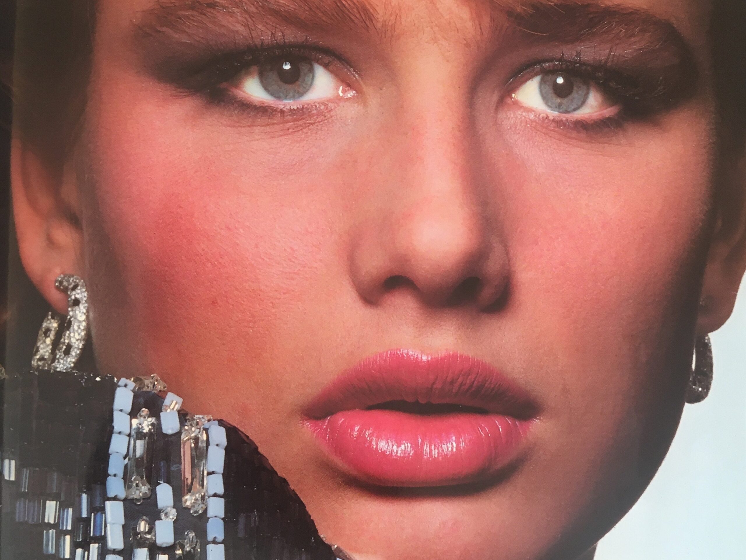 Hunter Reno photographed by Albert Watson wearing Cartier Panthère hoop earrings cover of Vogue Paris April 1984.